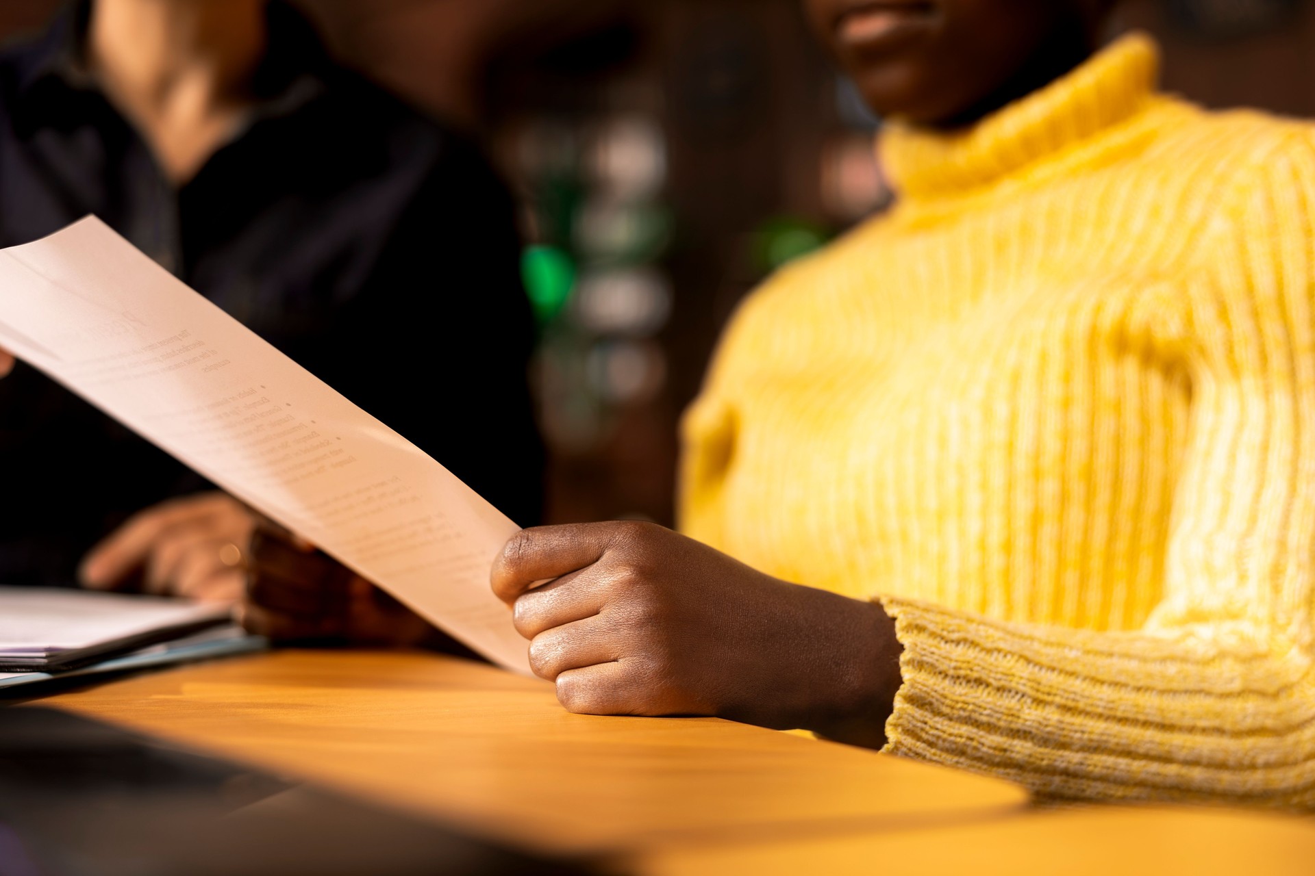 African american schoolgirl receiving personalized learning materials